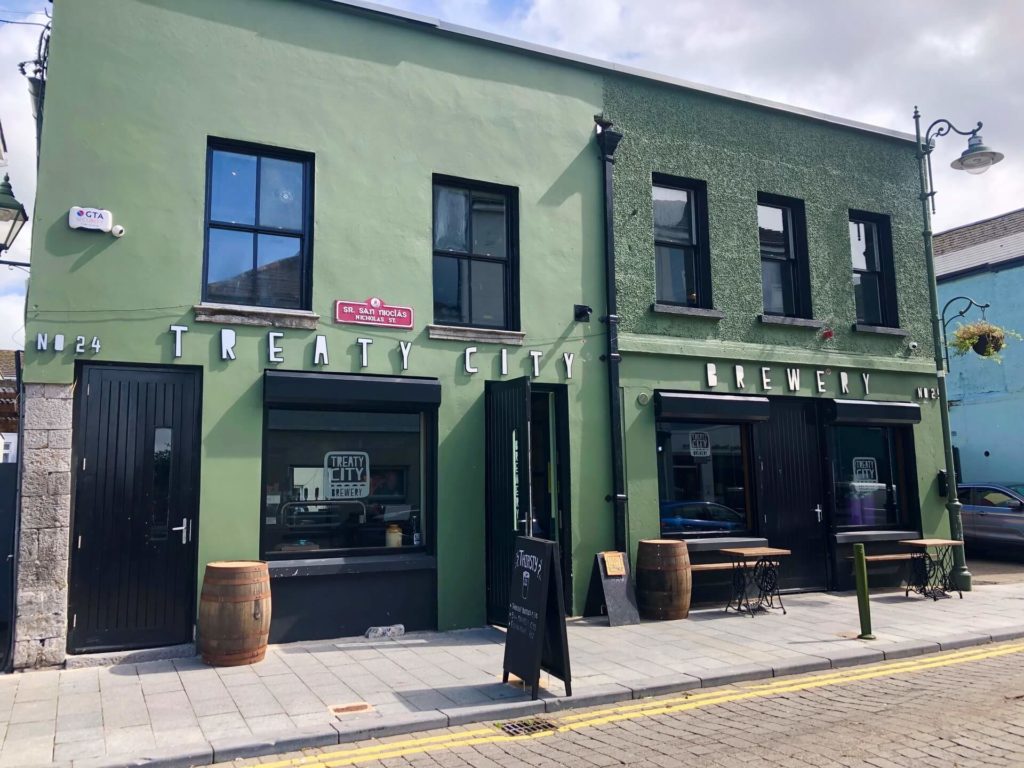 A green two-story building with 