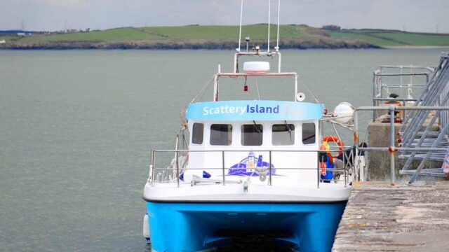 A blue and white ferry labeled