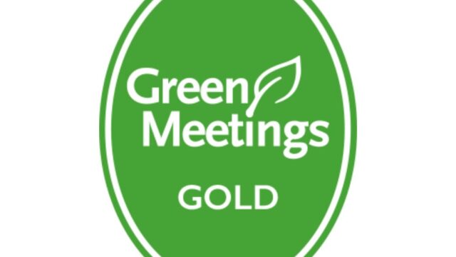 A green oval badge with the words